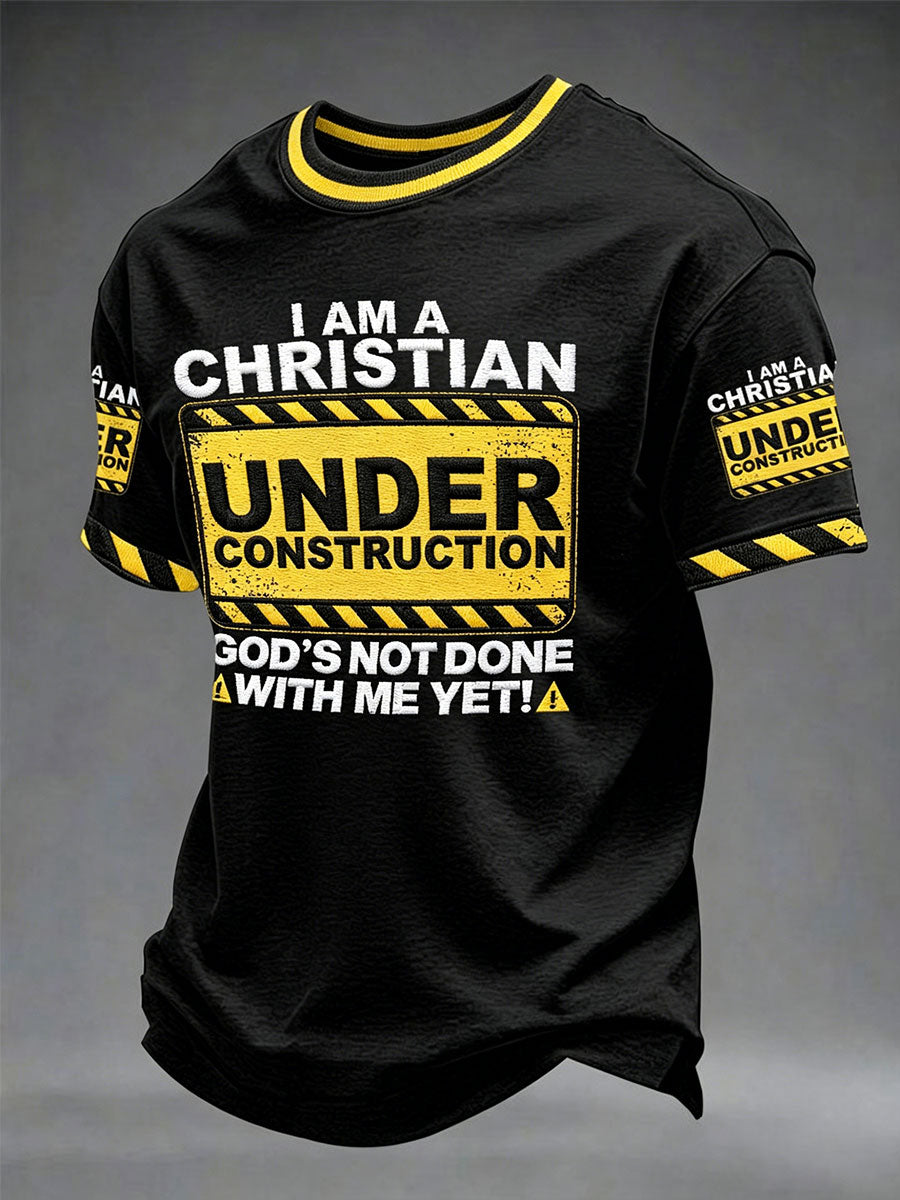 Herren-T-Shirt "Ich bin ein Christin im Bau, Gott hat noch nicht mit mir getan"